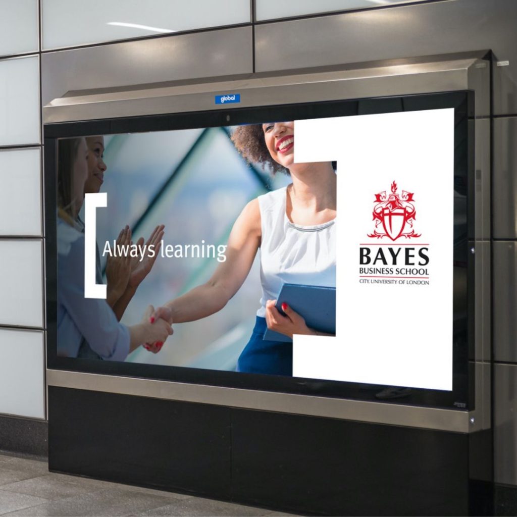 An advert displayed on the London Underground for Bayes Business School using a digital 12-sheet billboard.