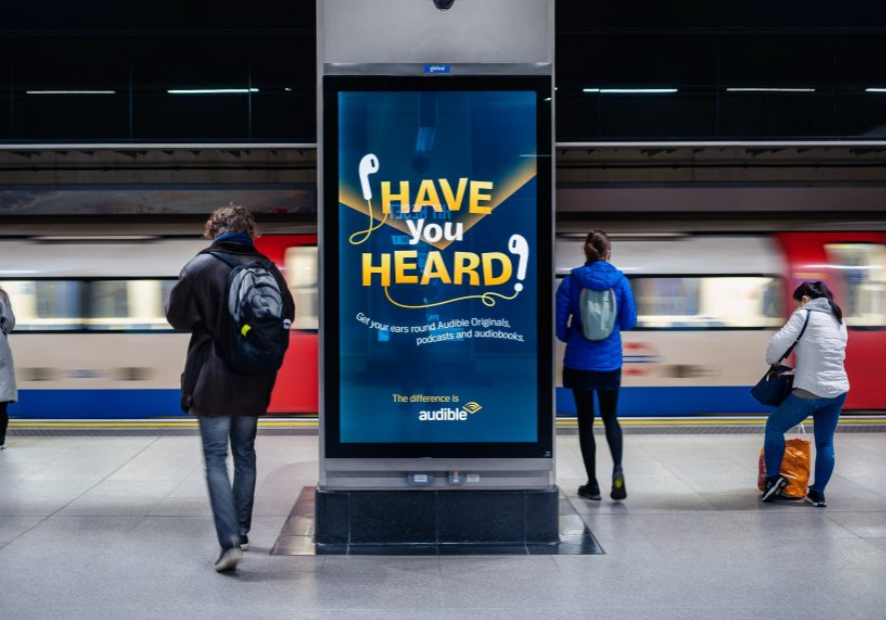 An advert for Audible displayed on the London Underground using a digital 6 sheet poster.